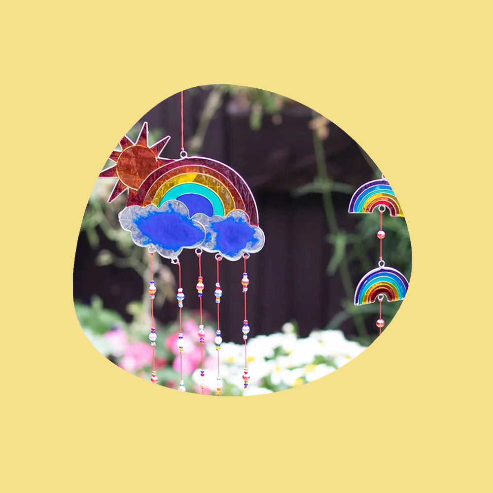 Rainbow coloured sun catcher hanging out in the garden