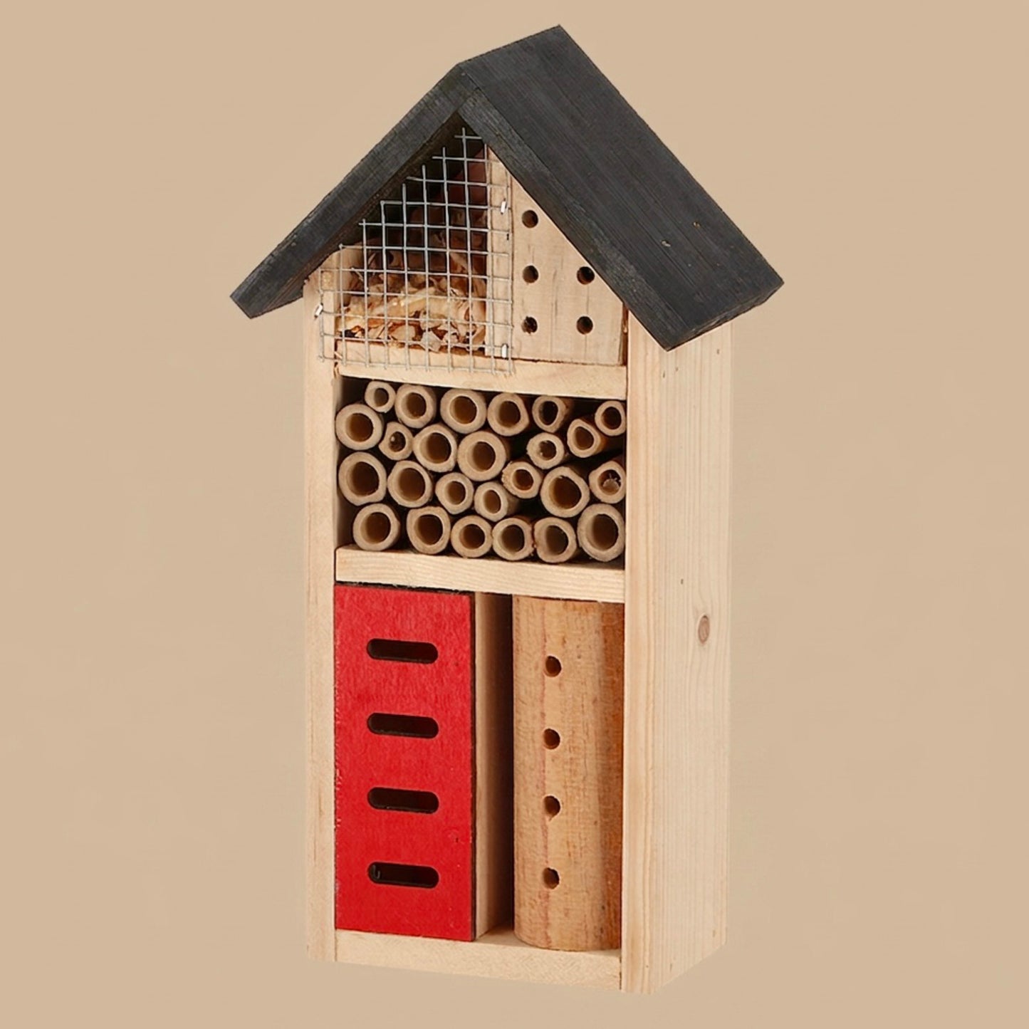 Wooden insect hotel with various compartments on a beige background